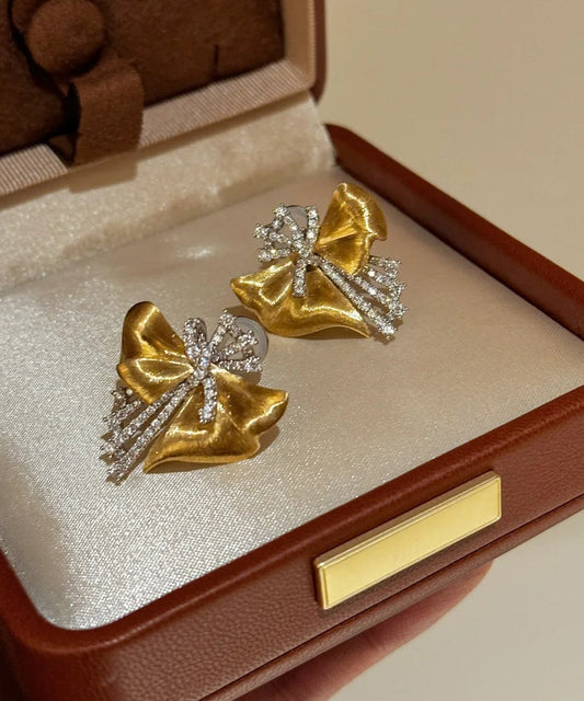 Gold Copper Zircon Asymmetrical Bow Stud Earrings