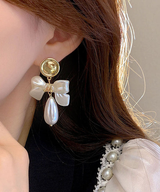 White Copper Alloy Pearl Bow Drop Earrings